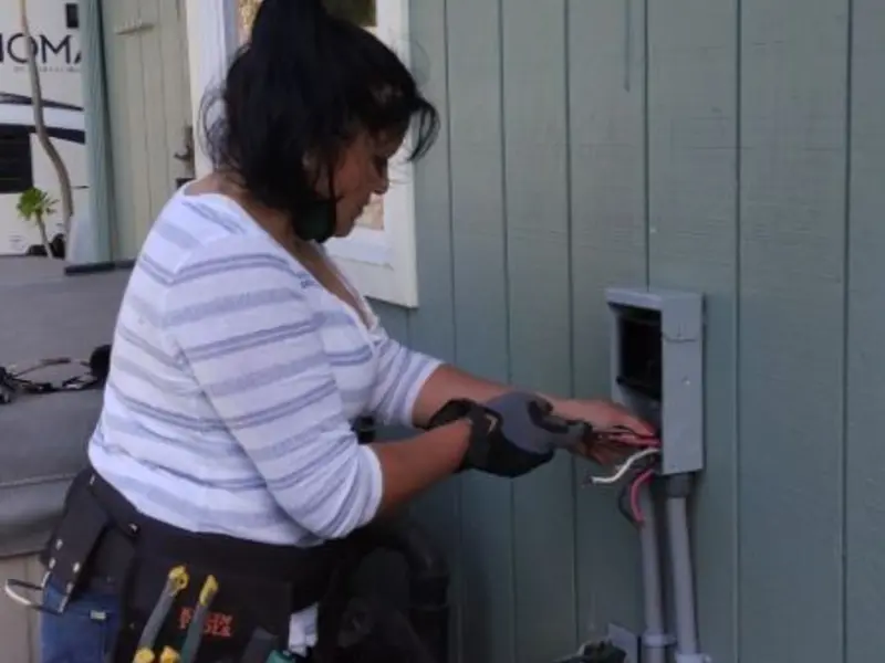 Licensed electrician wiring an exterior subpanel in White Center